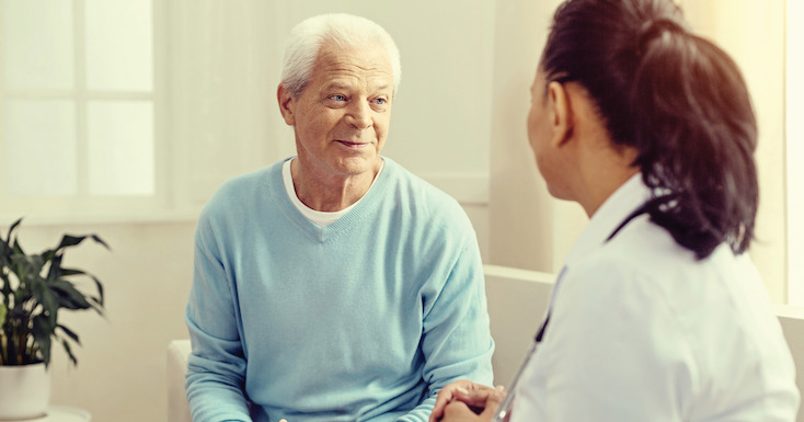 elderly man consulting with rehabilitation specialist