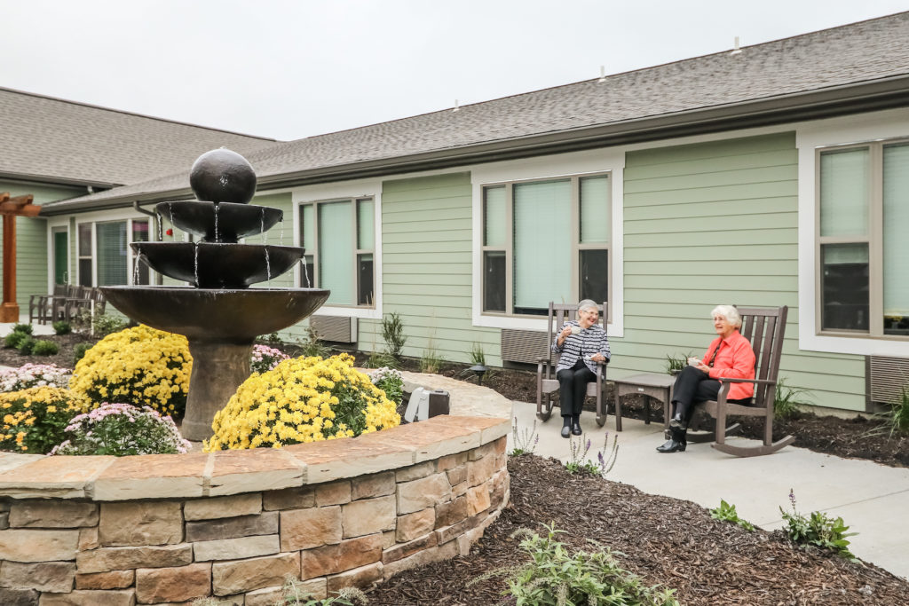 Rehabilitation center patients at the courtyard fountain
