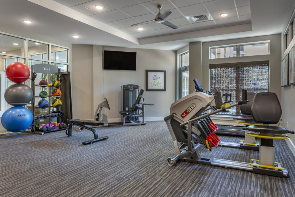 Senior living community gym with machines and equipment