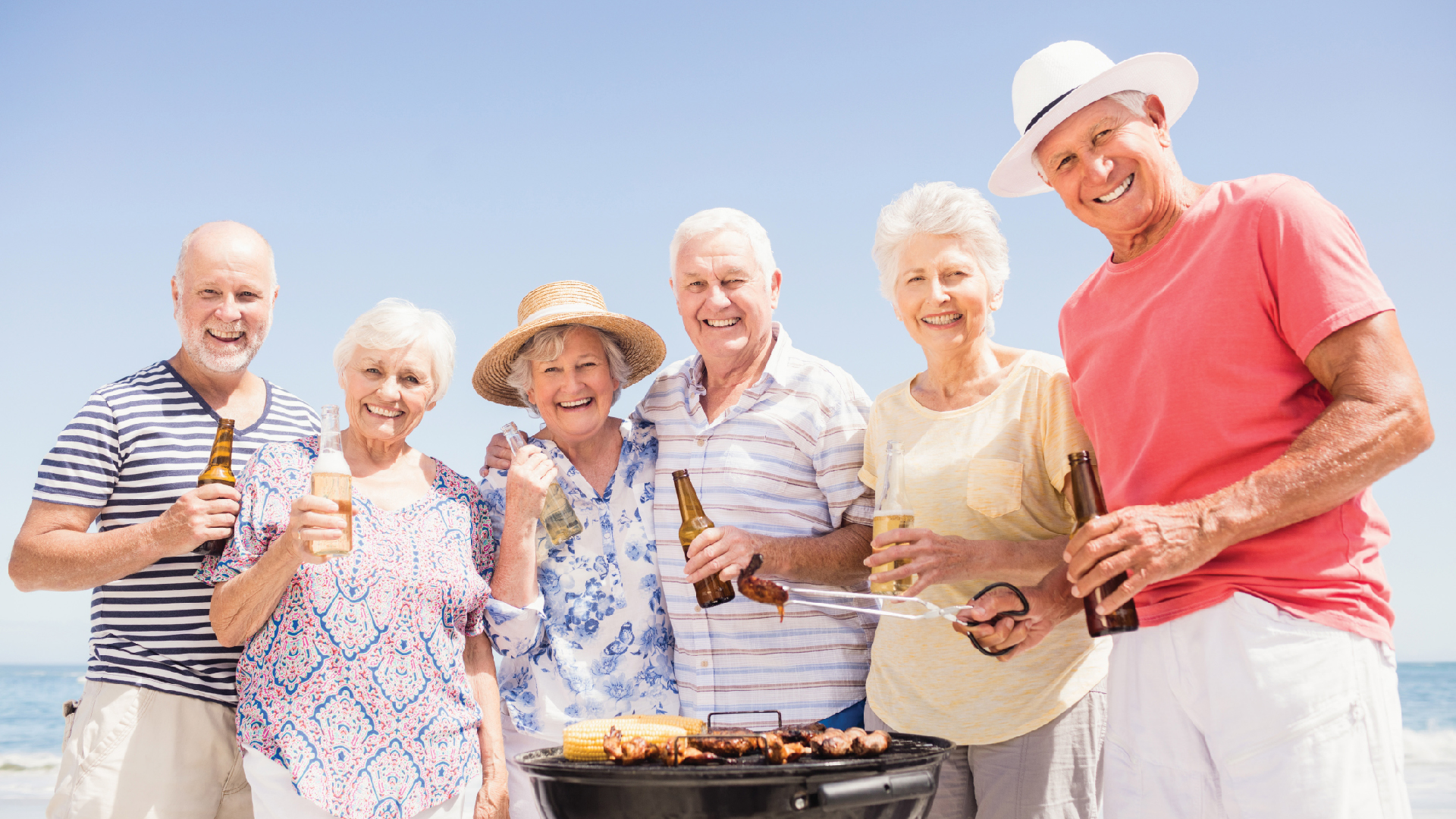 group of elderly people outside laughing